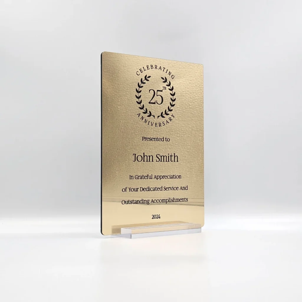 Personalized Anniversary Keepsake Gold Plaque with custom laser engraving in black, displayed in a transparent base.