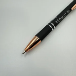 Personalized Metal Pen with custom engraving and built-in stylus, featuring sleek black design with rose gold accents