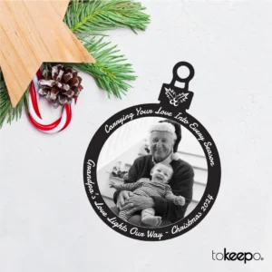 Personalized black acrylic Christmas ornament with white laser engraving, featuring custom designs and text, measuring 100x75 mm (4x3 inches).