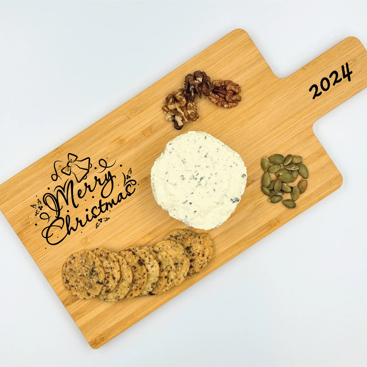 Personalized bamboo charcuterie board with engraved text and design, perfect for serving and gifting.