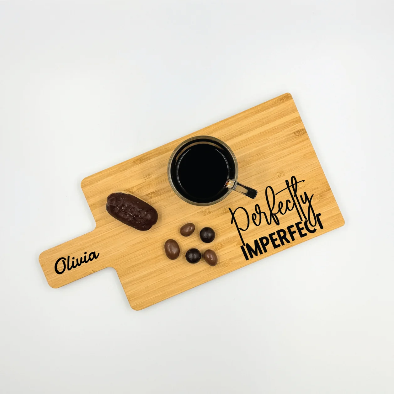Personalized bamboo charcuterie board with engraved text and design, perfect for serving and gifting.