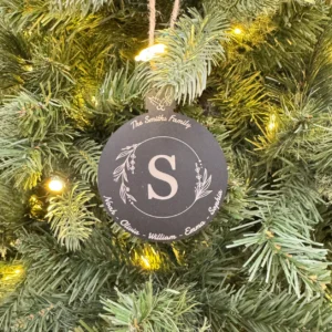 Personalized black acrylic Christmas ornament with white laser engraving, featuring custom designs and text, measuring 100x75 mm (4x3 inches).