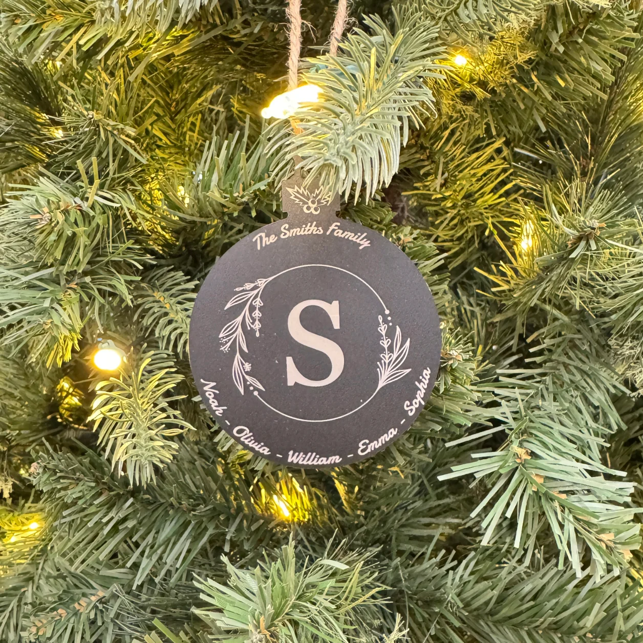 Personalized black acrylic Christmas ornament with white laser engraving, featuring custom designs and text, measuring 100x75 mm (4x3 inches).