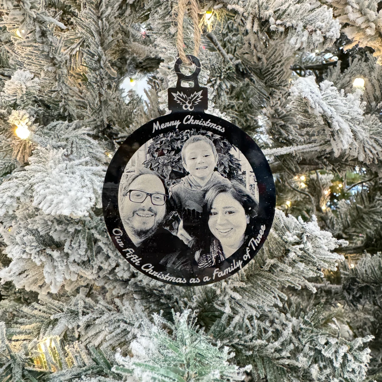 Personalized black acrylic Christmas ornament with white laser engraving, featuring custom designs and text, measuring 100x75 mm (4x3 inches).