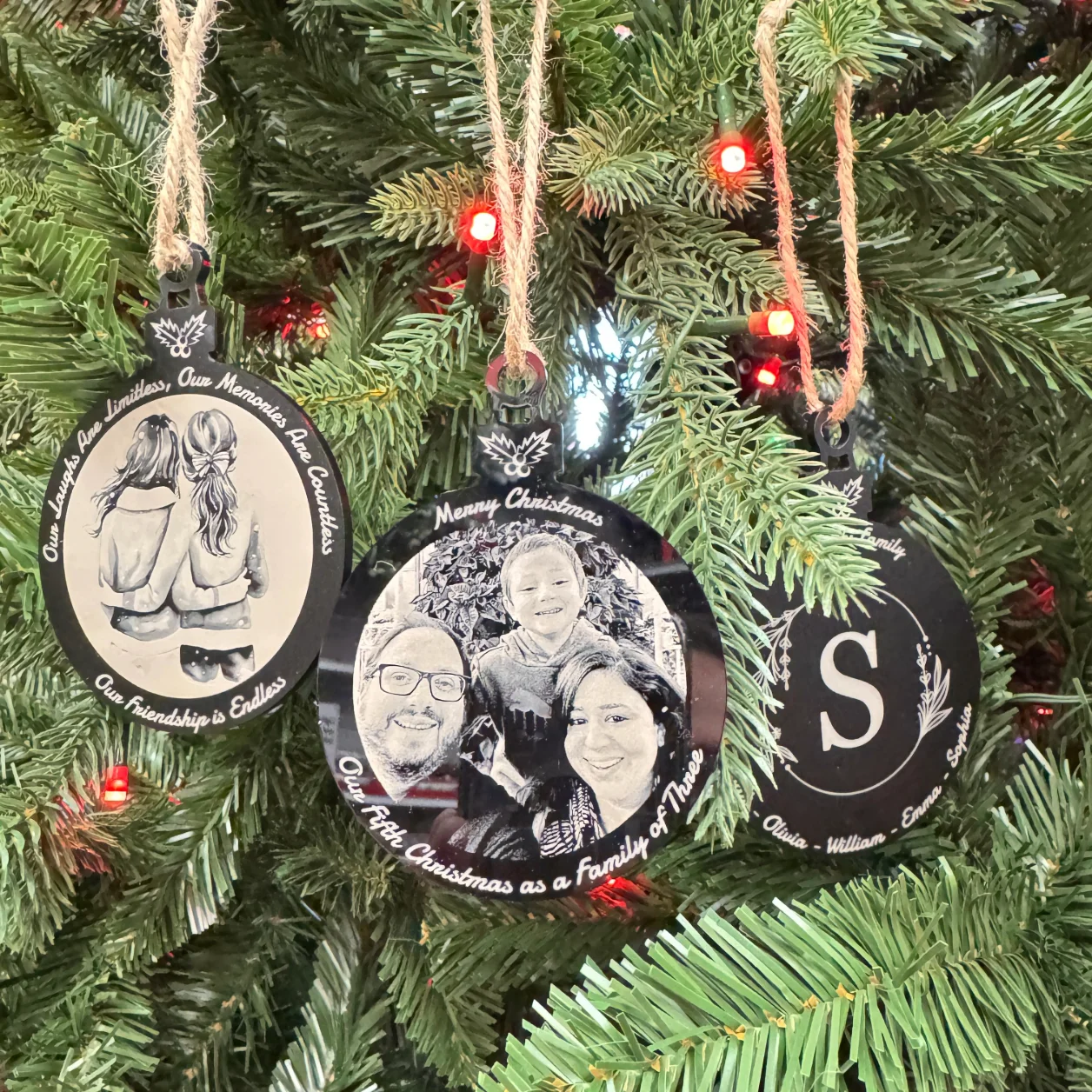 Personalized black acrylic Christmas ornament with white laser engraving, featuring custom designs and text, measuring 100x75 mm (4x3 inches).