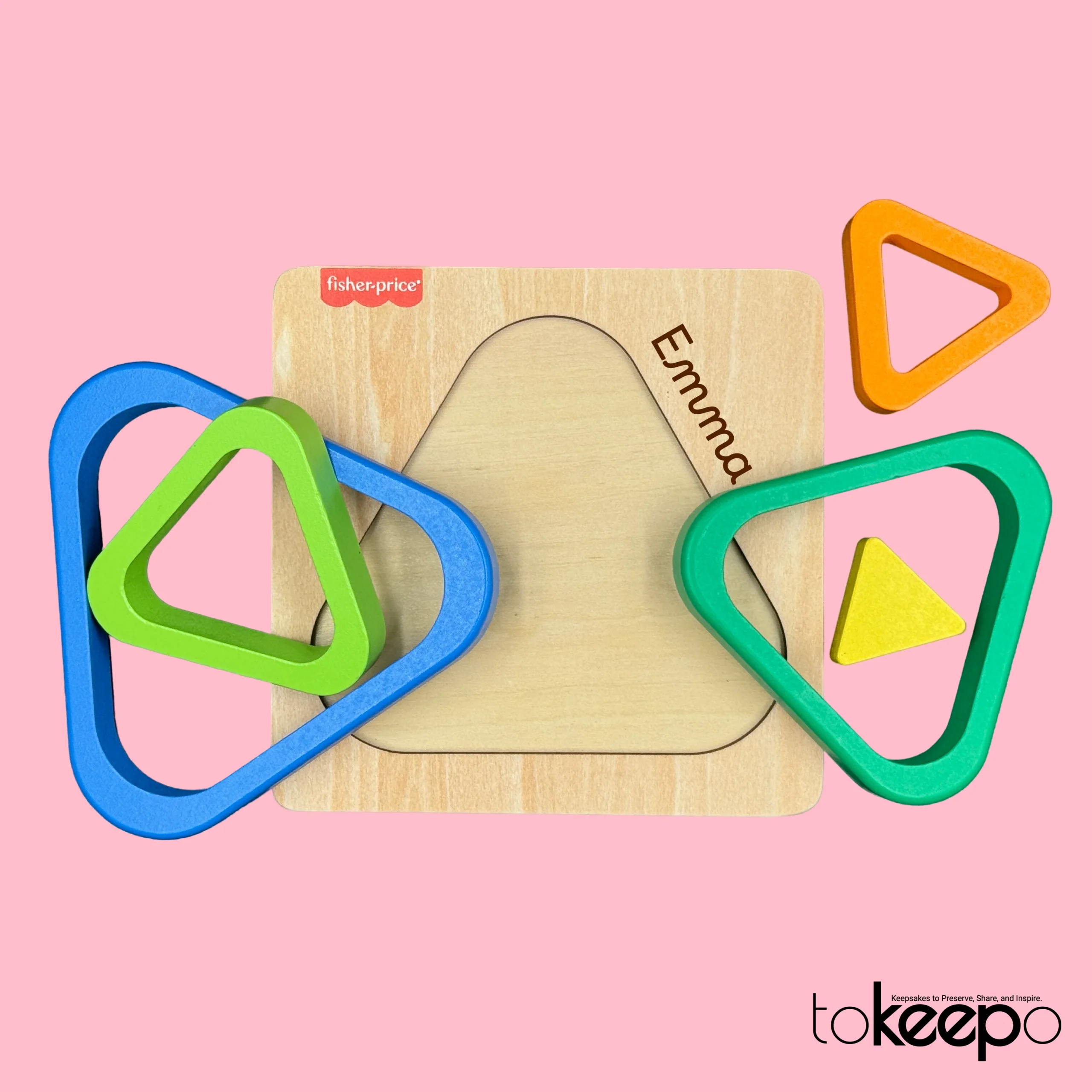 Fisher-Price® wooden triangle puzzle for toddlers with colorful nesting layers, customizable with a name through tokeepo's personalization service.