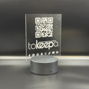 LED Acrylic Desk Lamp by tokeepo with a glowing acrylic plaque featuring engraved designs, including a QR code and logo, illuminated on a laser engraved transparent acrylic.