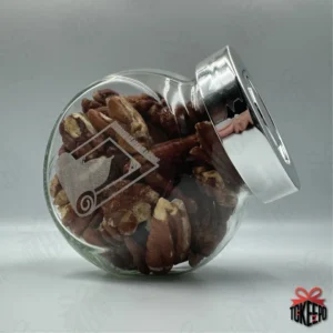 Engraved glass reward jar labeled for Salah, filled with pecans and shown on its side with a silver lid.